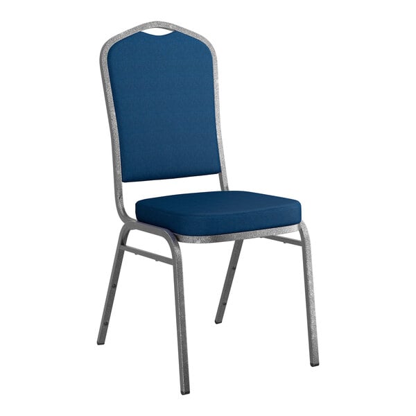 A stackable banquet chair with navy fabric upholstery and a silver vein metal frame.