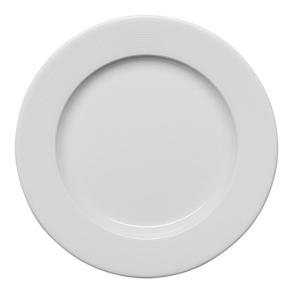 A white round porcelain plate with an embossed wide rim.