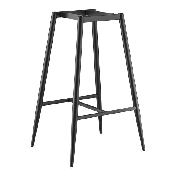 A black metal bar height table base with a mid-century design and four angled legs.