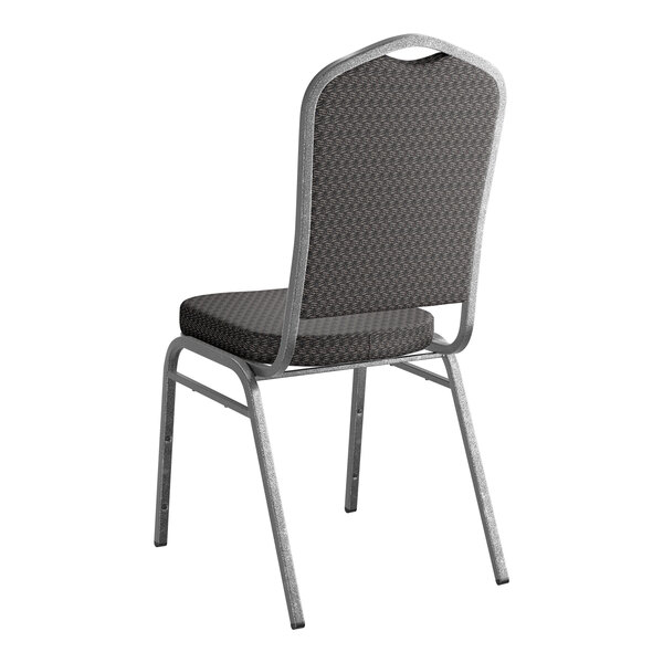 A stackable banquet chair with black patterned fabric and a silver vein metal frame.