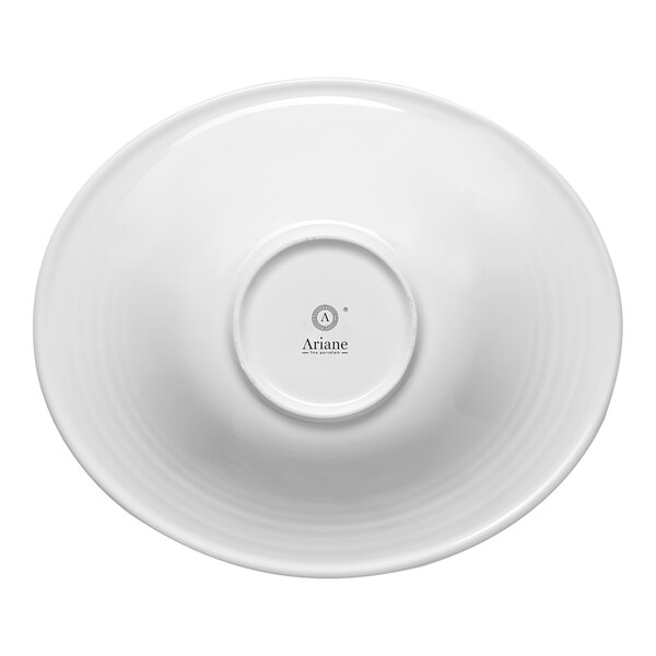 A white oval porcelain bowl with a wide rim, shown upside down to display the brand name Ariane on the base.