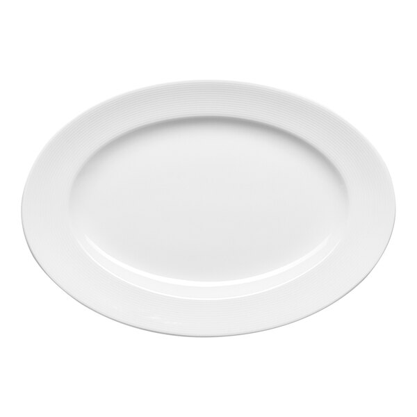 An oval white porcelain platter with an embossed wide rim.