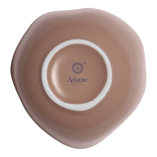 A gold and brown irregular round porcelain bowl viewed from the bottom.