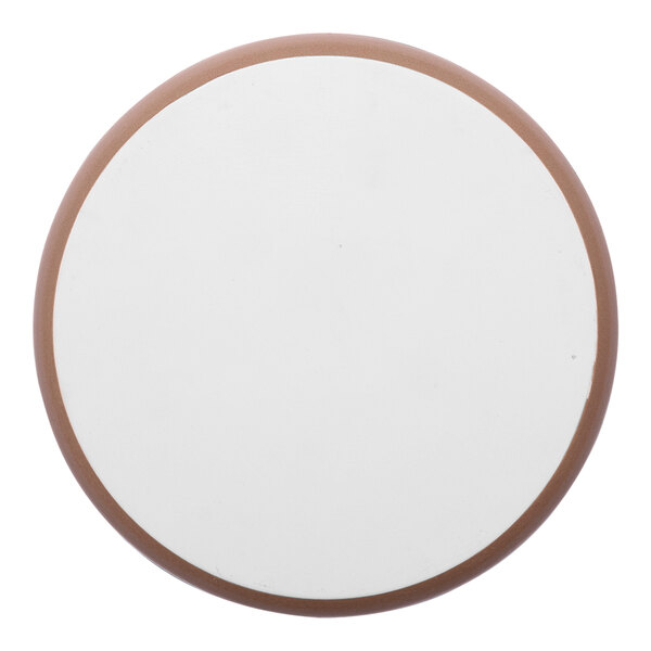 A round porcelain plate with a white center and a gold and brown rim.