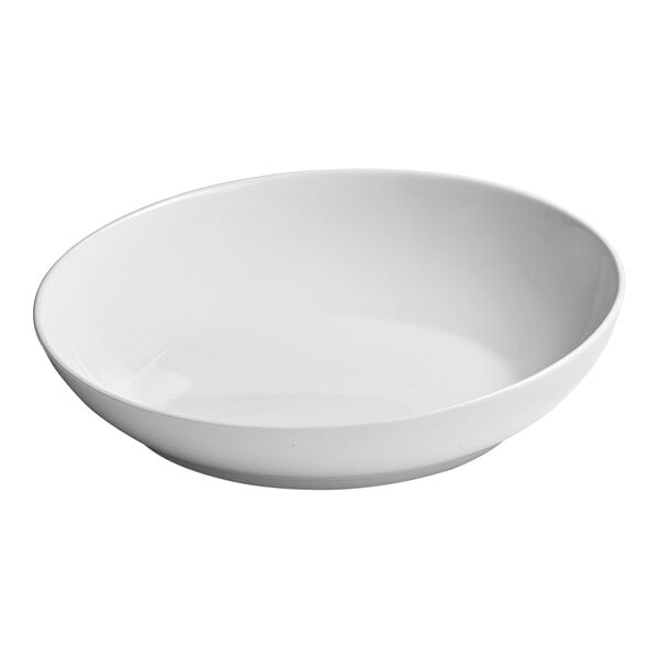 A white porcelain coupe bowl with a slanted rim.