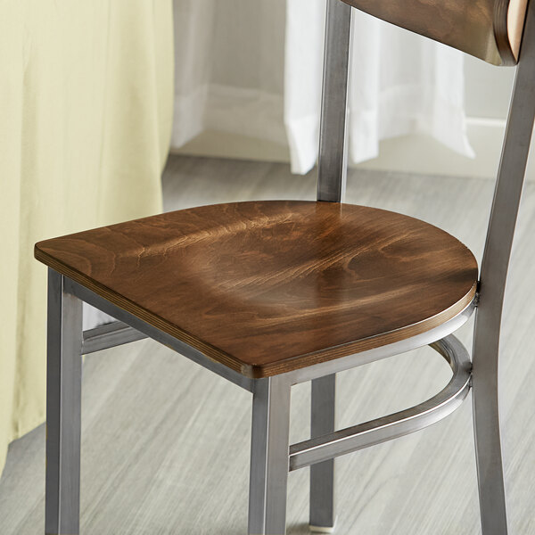 A wooden seat designed for use with metal frame chairs.