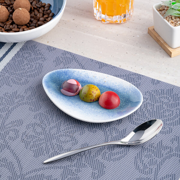 A small blue and white ombre triangular porcelain coupe plate.
