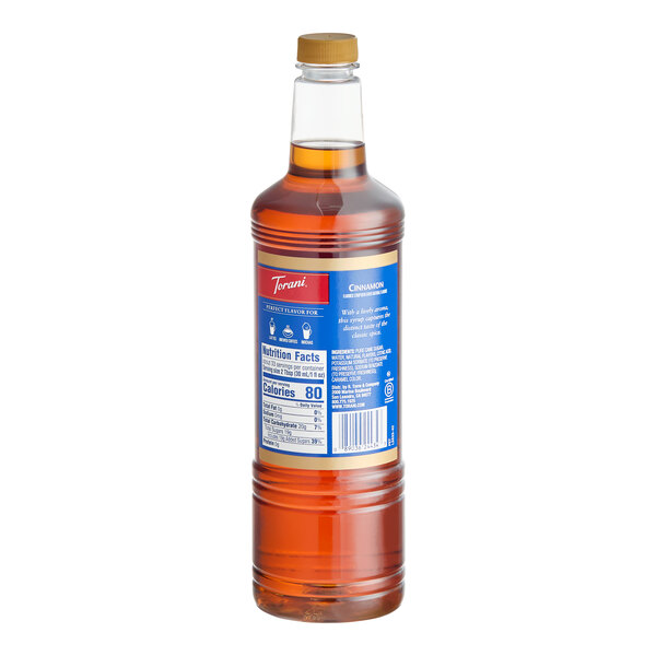 A 1-liter plastic bottle of Torani Cinnamon Flavoring Syrup.