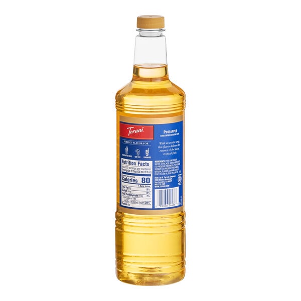 A 1-liter plastic bottle of Torani Pineapple flavoring and fruit syrup.