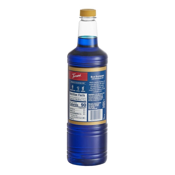 A 1-liter plastic bottle of Torani Blue Raspberry flavoring and fruit syrup.