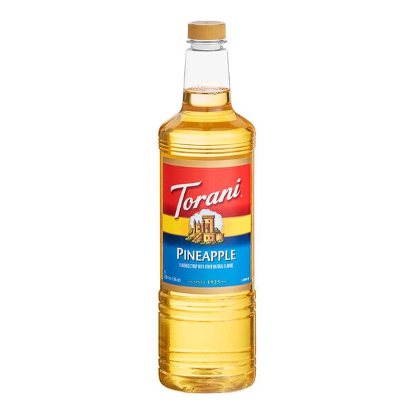 A 1-liter plastic bottle of Torani Pineapple flavoring syrup.