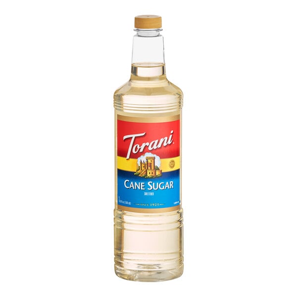 A 1-liter plastic bottle of Torani Cane Sugar Sweetener Syrup.
