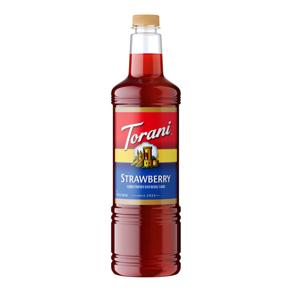 A plastic bottle of Torani Strawberry Syrup with red liquid inside.