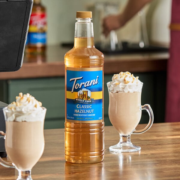 A 1-liter plastic bottle of Torani Sugar-Free Classic Hazelnut Flavoring Syrup.