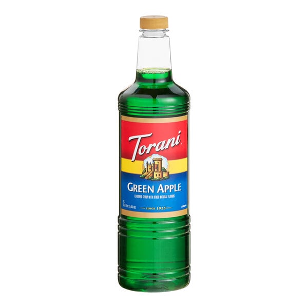 A 1-liter plastic bottle of Torani Green Apple flavoring syrup.