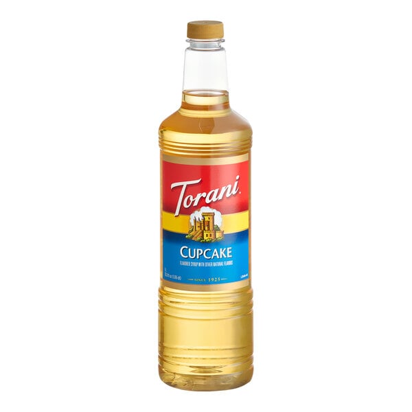 A 1-liter plastic bottle of Torani Cupcake flavoring syrup.