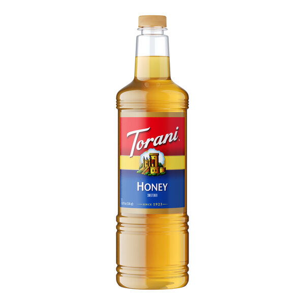 A Torani plastic bottle of honey sweetener syrup with a label.
