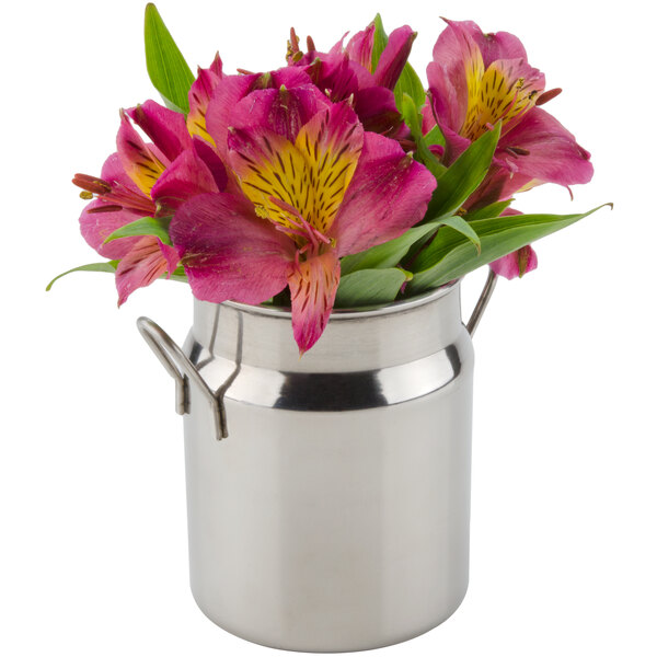 An American Metalcraft stainless steel milk can creamer with pink flowers.