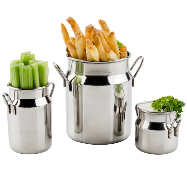 A close-up of an American Metalcraft stainless steel milk can filled with cream.