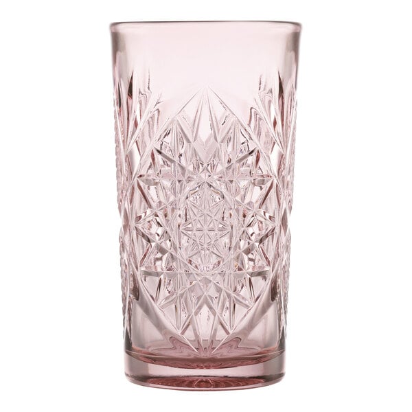 A pink-tinted, intricately patterned 16 oz. cooler glass.