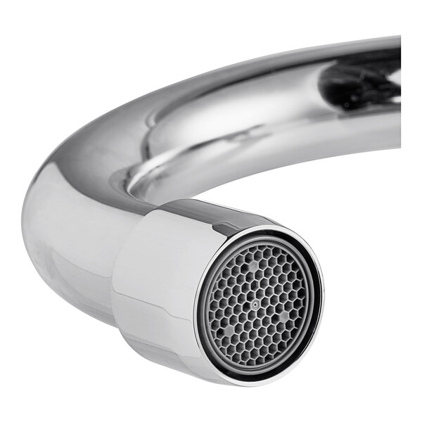 A close-up of a chrome wall-mount hands-free faucet spout with an aerator.