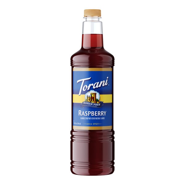 A Torani Sugar-Free Raspberry Fruit Syrup plastic bottle with a blue and yellow label.