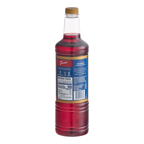 A 1-liter plastic bottle of Torani Raspberry flavoring and fruit syrup.