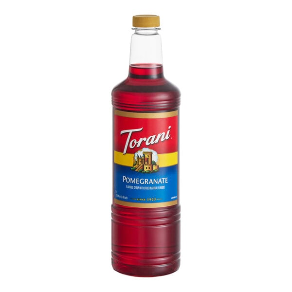 A 1-liter plastic bottle of Torani Pomegranate flavoring and fruit syrup.