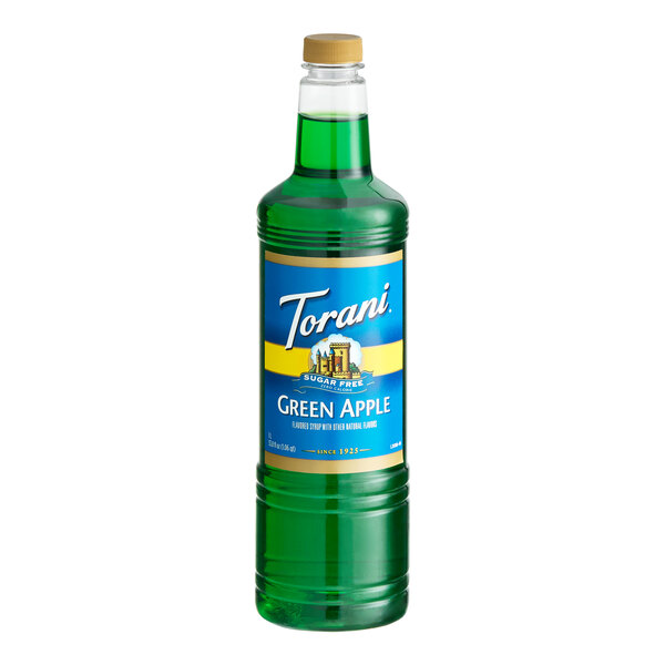 A 1-liter plastic bottle of Torani Sugar-Free Green Apple flavoring syrup.