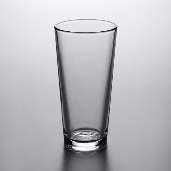 A clear, tall 20 oz. mixing glass with a slightly tapered shape.