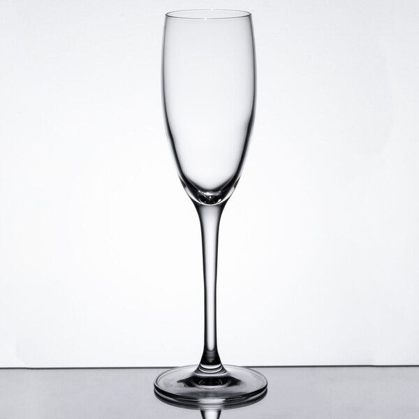 A clear 6 oz. flute glass with a long stem and narrow bowl.