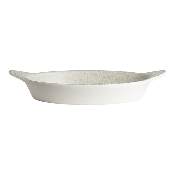 A white oval melamine dish with small handles on each end.