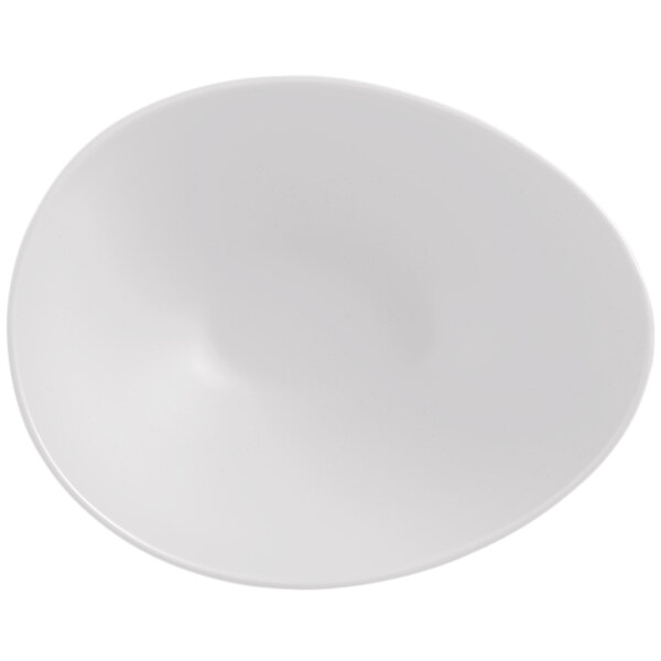 A white, matte-finish porcelain bowl with an organic, asymmetrical shape.