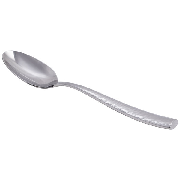 A stainless steel teaspoon with a hammered handle design.