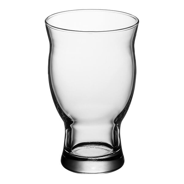 A clear, stackable 16.75 oz. craft beer glass with a slightly curved shape and thick base.