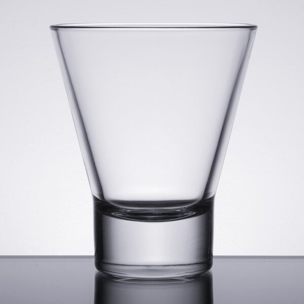A clear, conical-shaped rocks or double old fashioned glass with a thick base.