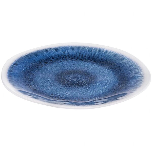 A round melamine plate with a blue ocean-inspired design.