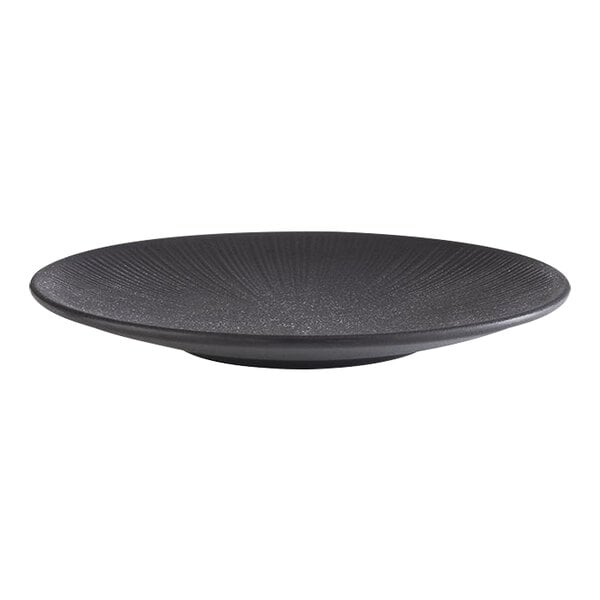 A round, black melamine plate with a textured surface and coupe design.