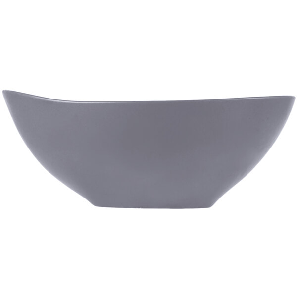 A gray matte porcelain bowl with an organic, curved shape.