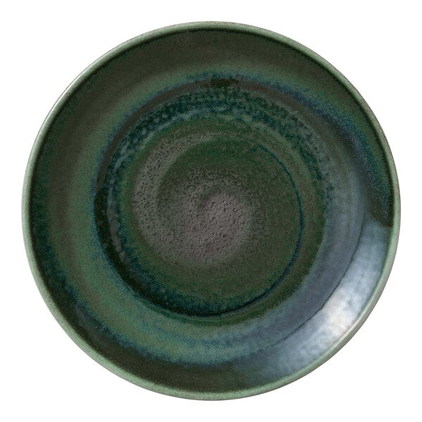 A round, green porcelain coupe plate with a textured, swirled design.
