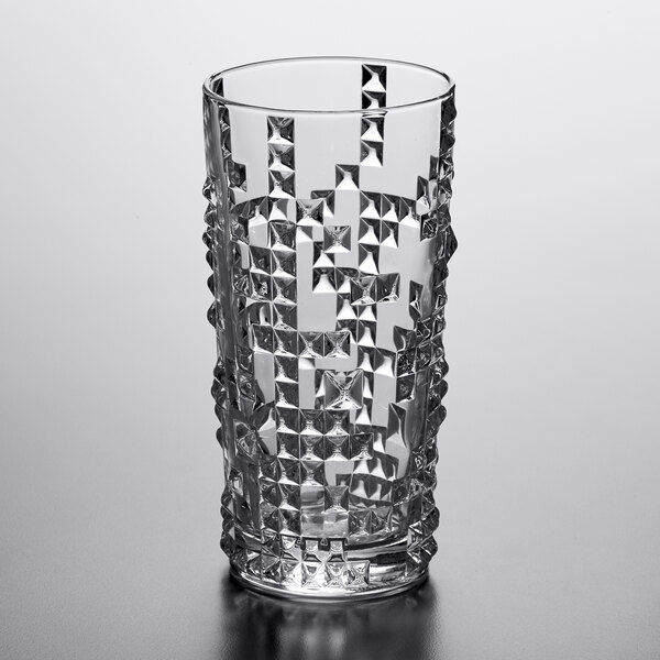 A clear glass with a geometric, textured pattern designed for serving long drinks or cocktails.