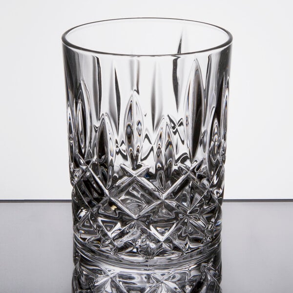 A clear, intricately patterned 10 oz. rocks or old fashioned glass.