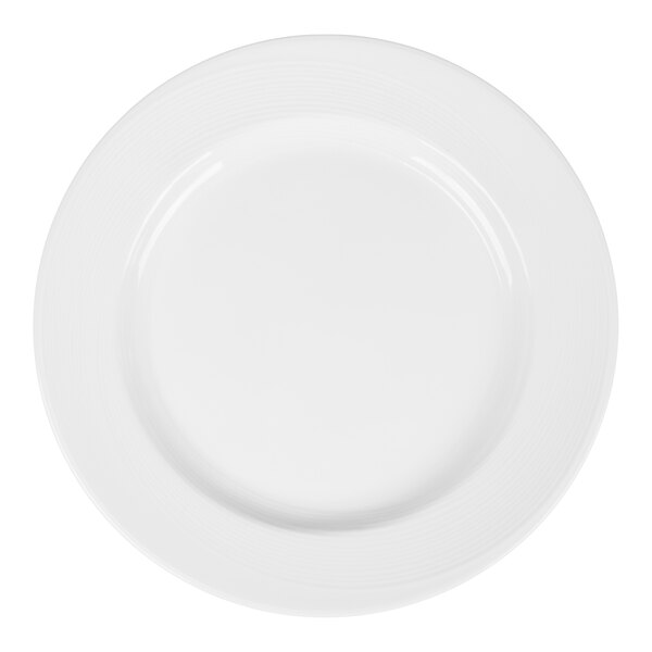A plain white round plate with a wide rim and subtle textured lines near the edge.