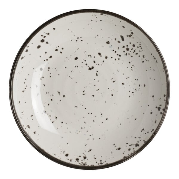 A round white melamine bowl with black speckled pattern and a dark rim.