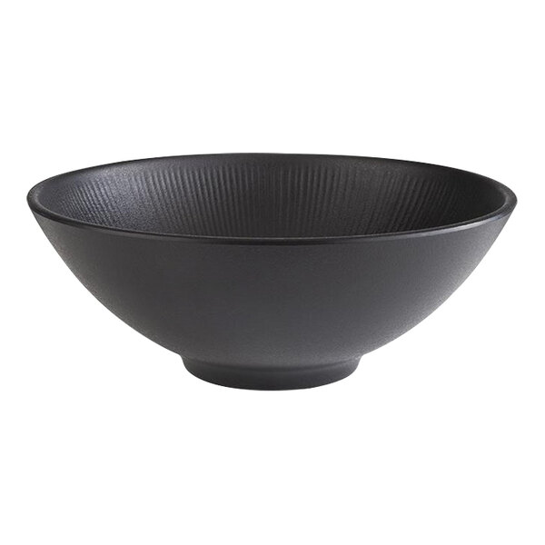 A large black round melamine bowl with a textured interior.