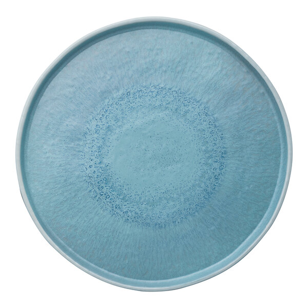 A small round blue melamine plate with a textured design.