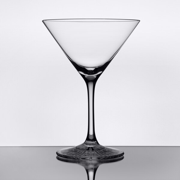 A clear, stemmed martini glass with a wide bowl and a flat base.