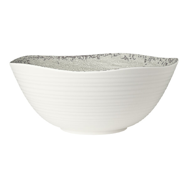 A large white melamine round bowl with a textured gray interior design.
