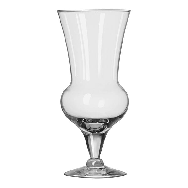 A clear 15 oz. thistle-shaped cocktail glass with a short stem and wide base.