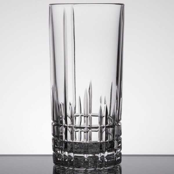 A clear Spiegelau Perfect Serve 11.75 oz. longdrink or Collins glass with a textured base.